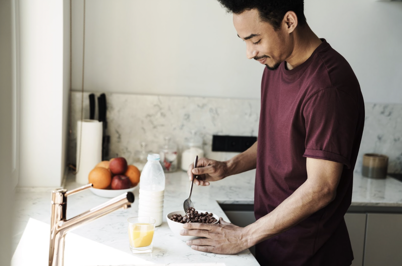 Man making breakfast in a short-term rental