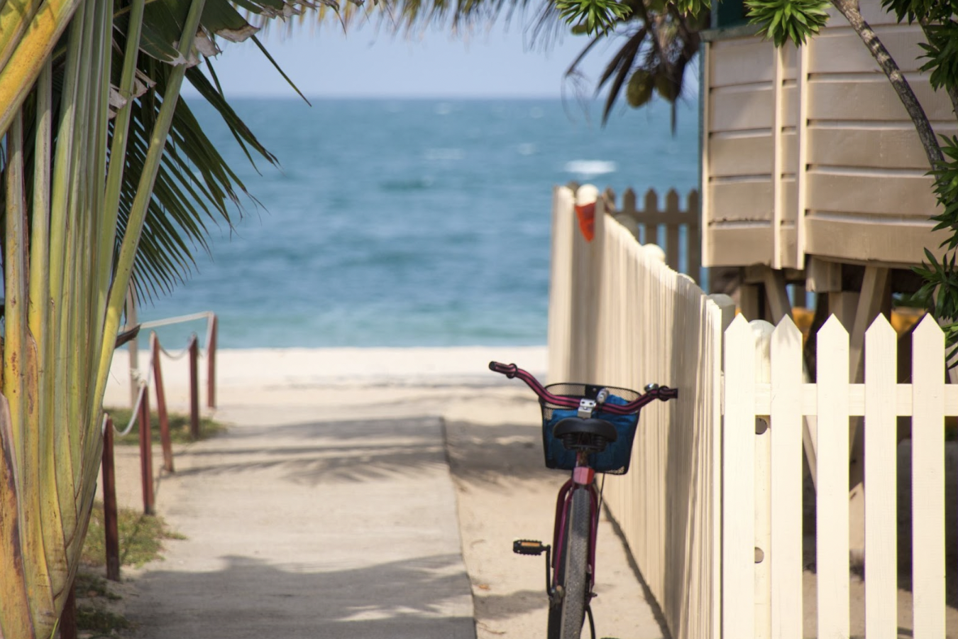 Bike parked in front of beach house.