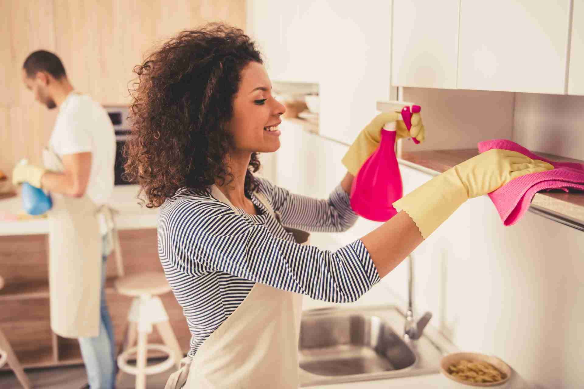 Woman and man cleaning a property