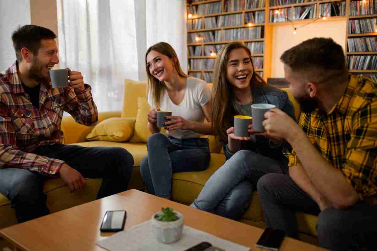 Airbnb extra guest fee group of friends hanging out