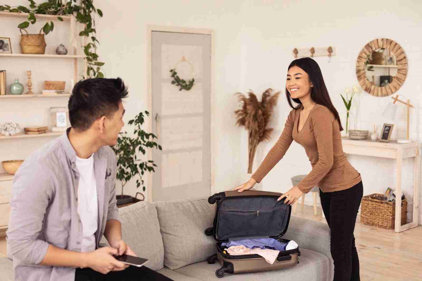 Couple unpacking in Airbnb